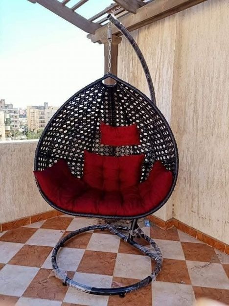 صورة single-hanging-rattan-egg-swing-chair