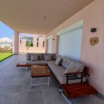 صورة outdoor-wooden-l-shaped-sectional-sofa-set-with-glass-top-coffee-table