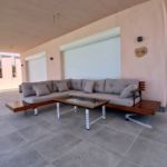 صورة outdoor-wooden-l-shaped-sectional-sofa-set-with-glass-top-coffee-table